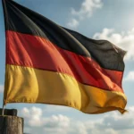 The national flag of Germany with three horizontal stripes of black, red, and gold, waving in the wind.